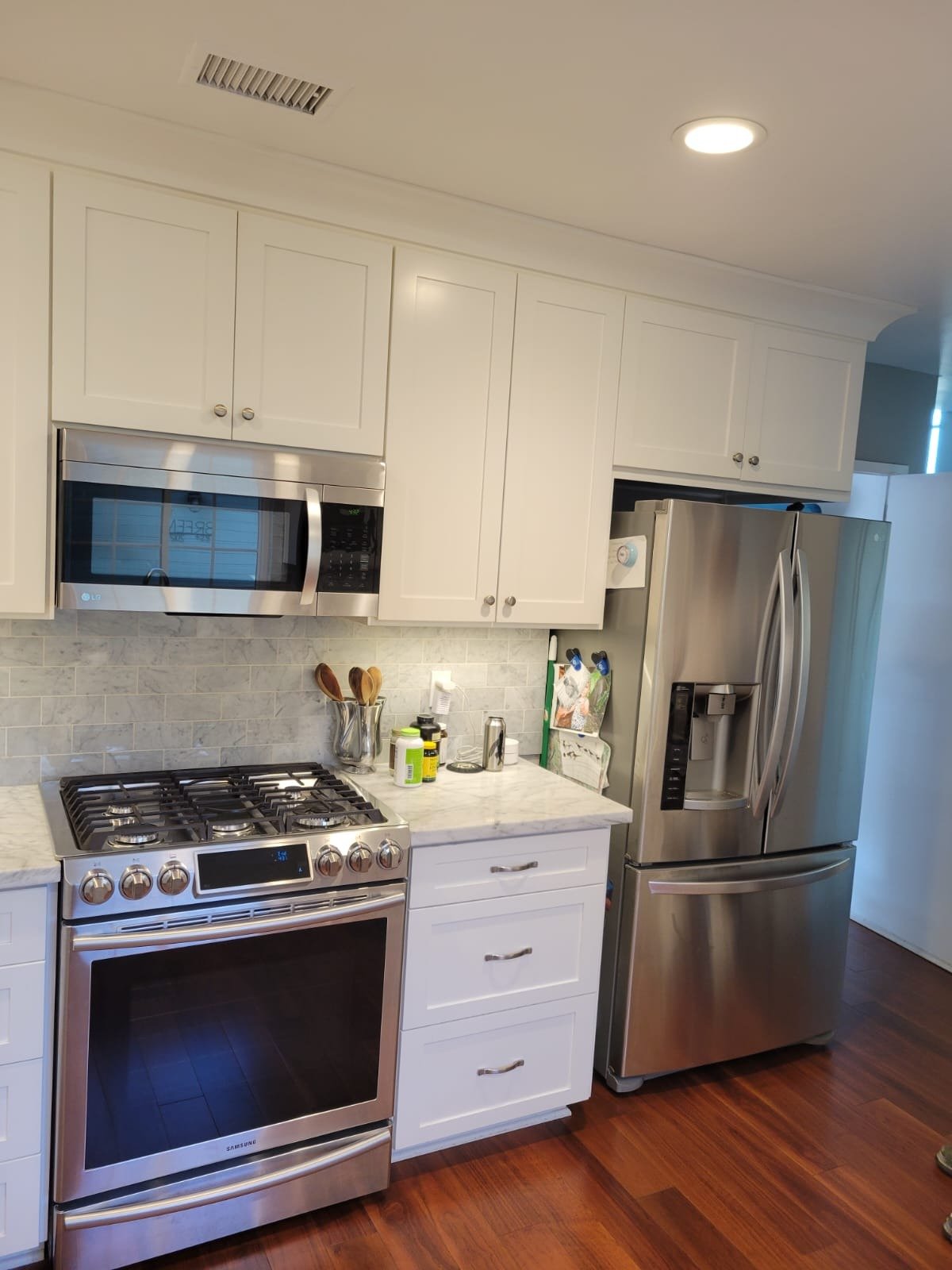 Finished white kitchen cabinet refinishing