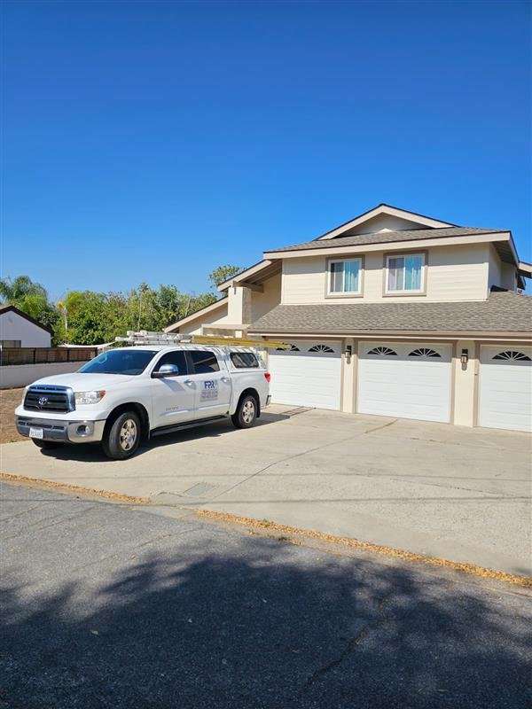 Fercho's Paint & Restoration service truck at a completed home project
